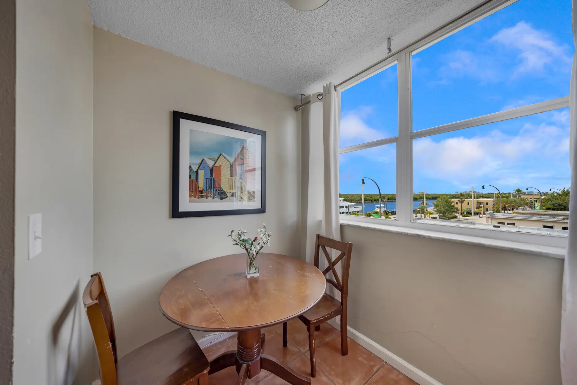 Studio suite dining table by the window